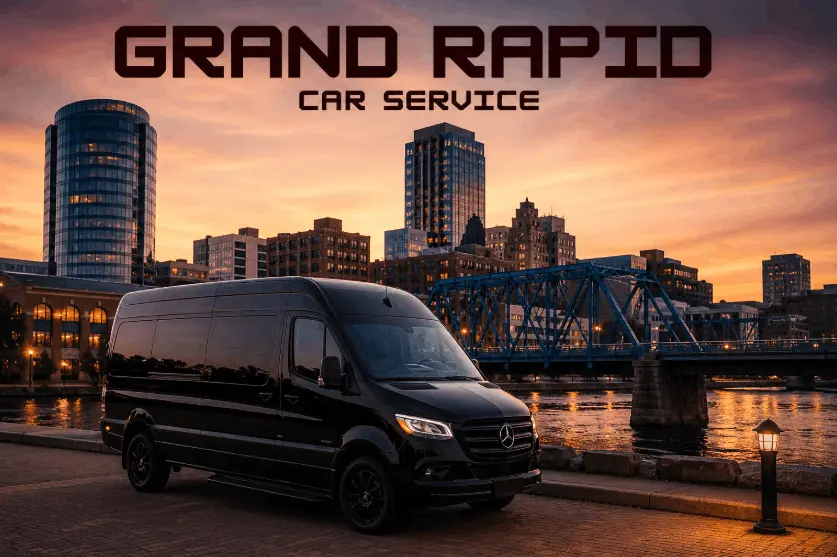 Luxury black Mercedes Sprinter van for Grand Rapid Car Service parked by the Grand River in downtown Grand Rapids at sunset, with city skyline and Blue Bridge in the background.